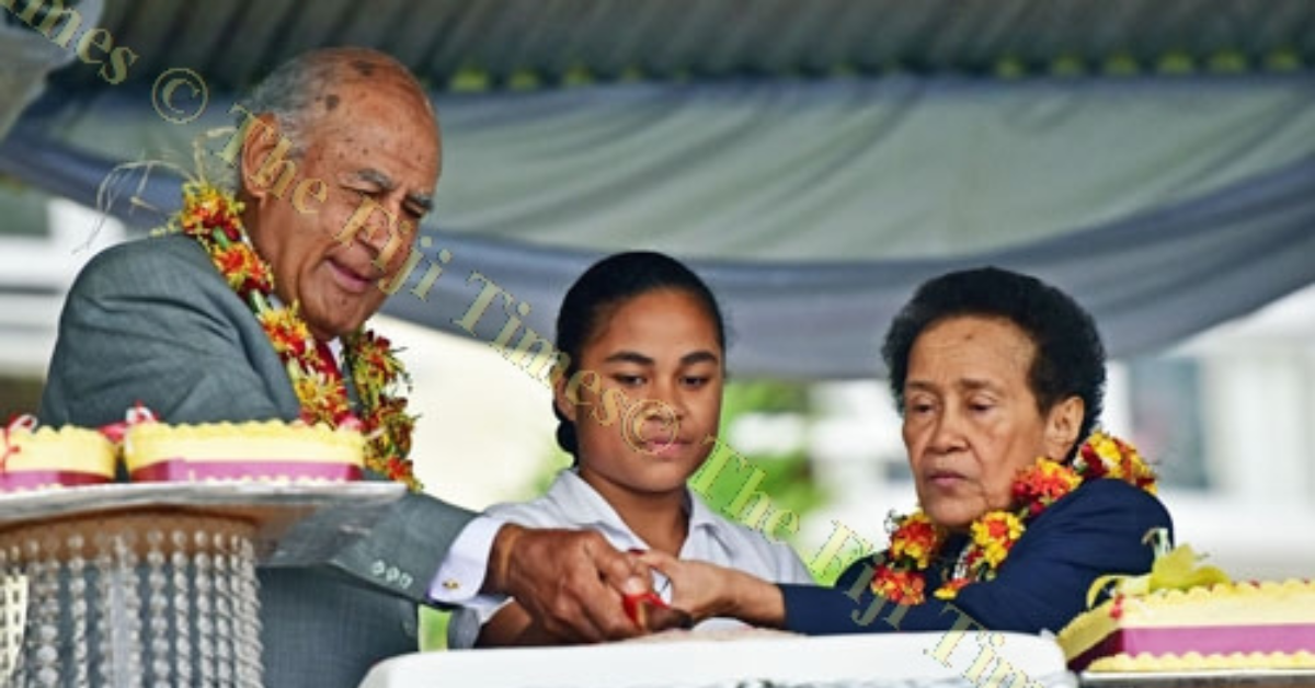 Ratu Epeli Nailatikau, Taufa Vakatale and the youngest student at ACS cut the school birthday cake.